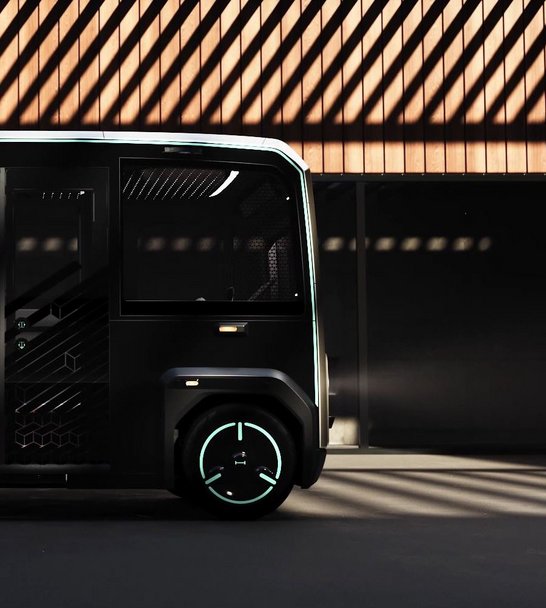 The front part of the mover in a sideview. The Background is a light wooden area